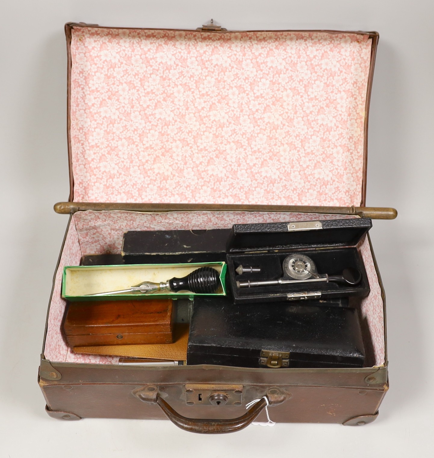 A small suitcase of draughtsman’s, scientific and medical instruments and a champagne tap